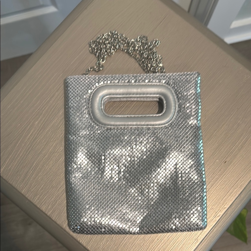 Sleek Silver Textured Clutch with Metallic Frame